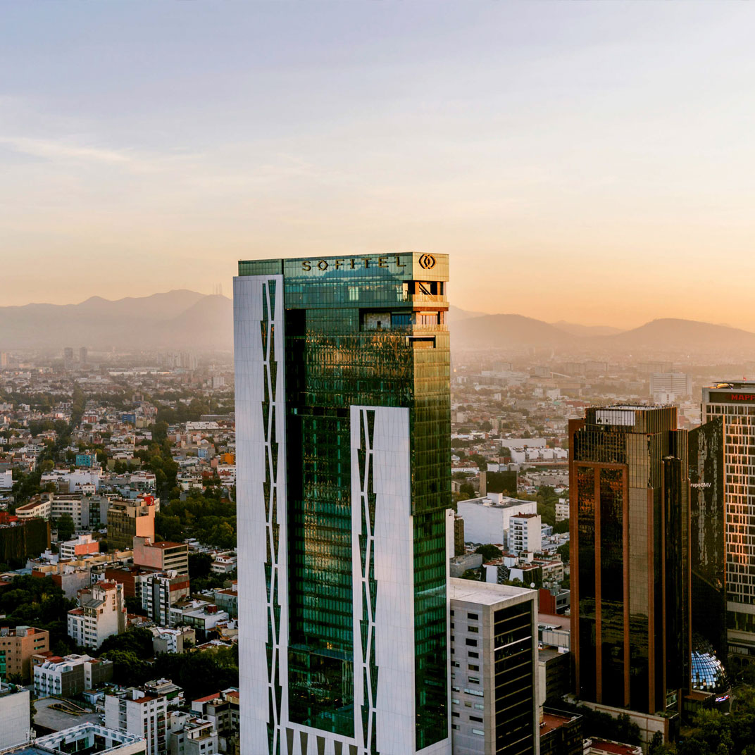 Exterior view of Sofitel Mexico City Reforma against the Mexico City skyline